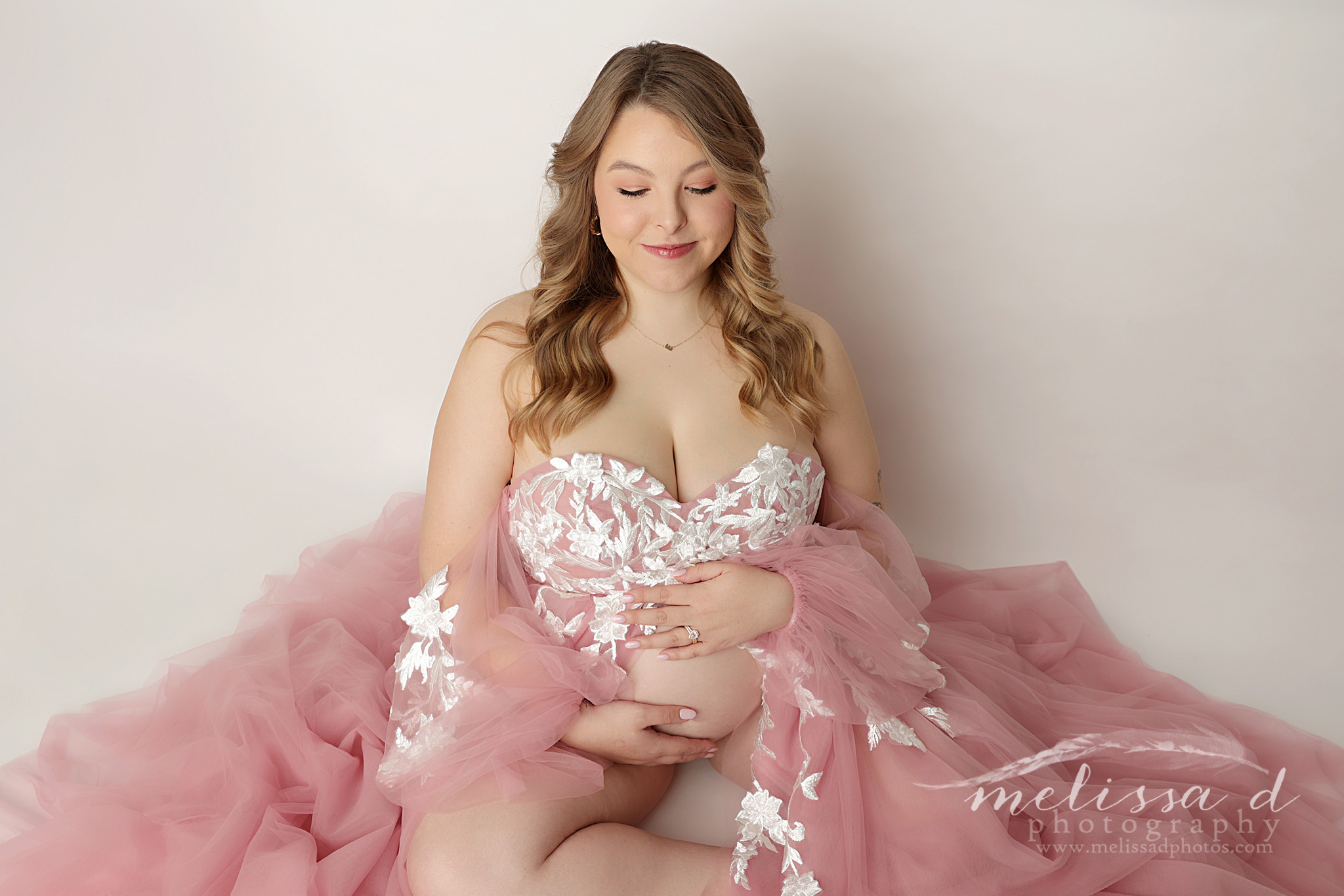 DFW Maternity Photographer sitting pose pink dress