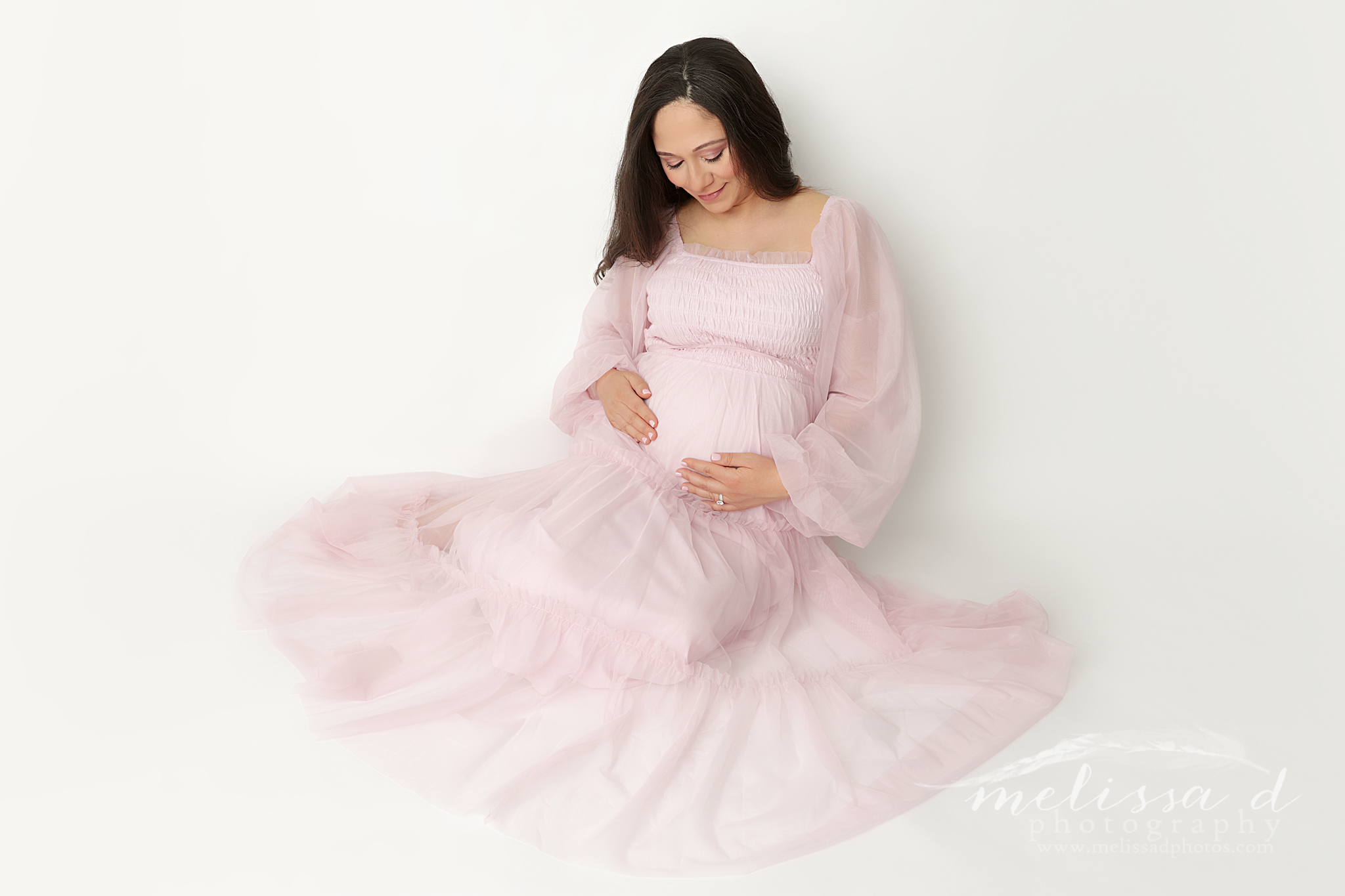 DFW Maternity Photographer sitting pose pink dress